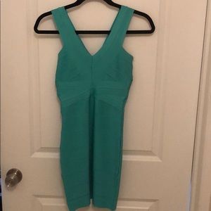Bebe bodycon mini bandage dress in teal.